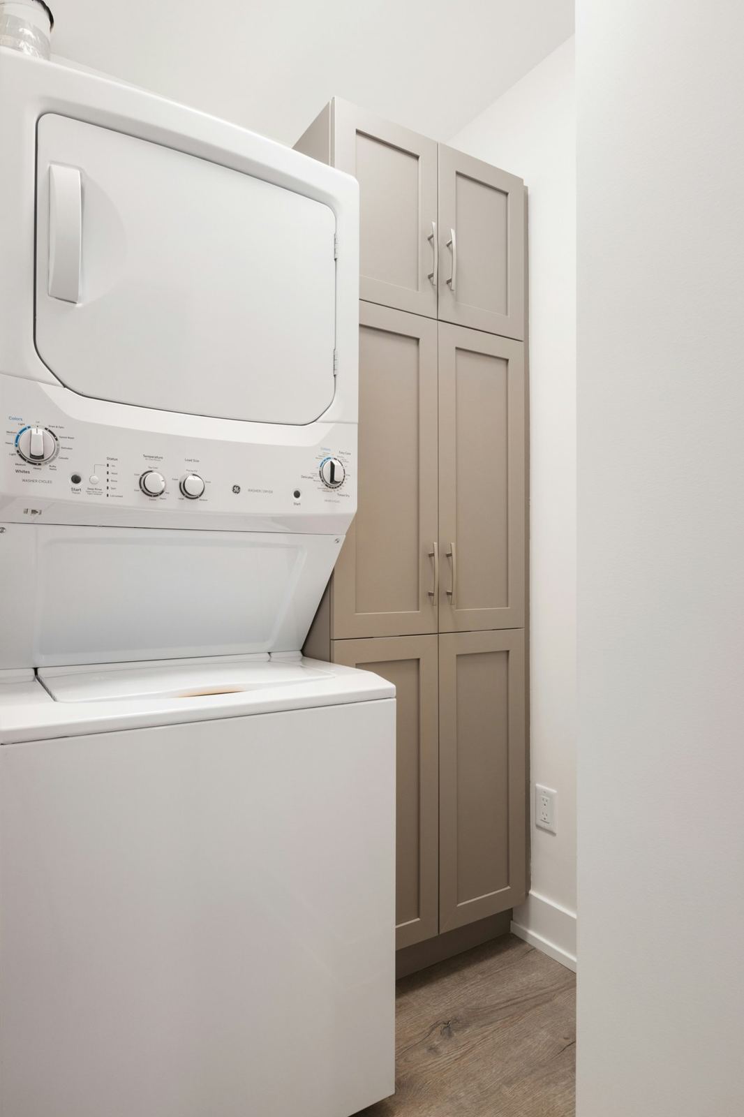Stacked washer and dryer in a laundry room